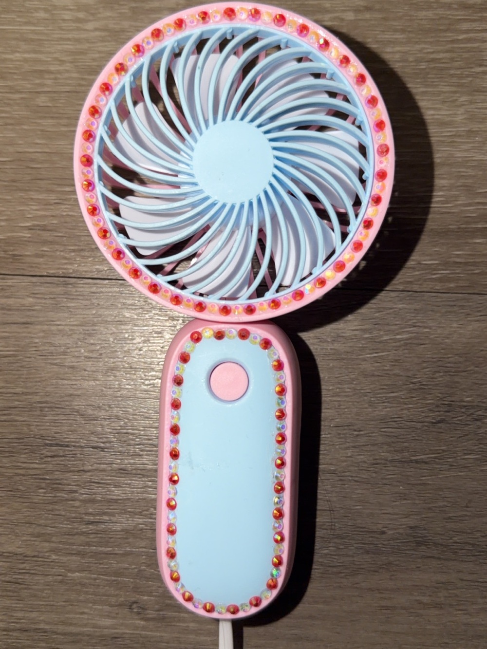 pink & blue handheld fan with red & white rhinestones